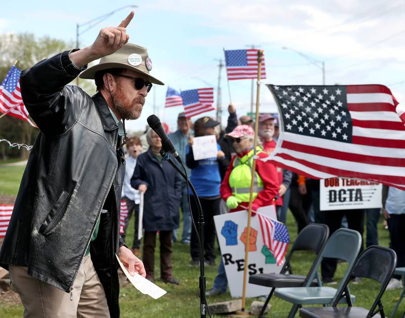 Northern Illinois University English professor Mark van Weinen, president of the United Faculty Alliance at NIU, speaks Saturday, May 3, 2025, at Hopkins Park in DeKalb during a May Day Rally for Democracy to protest against Trump administration policies.