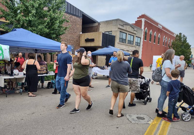 Shoppers stroll Madison Street in Ottawa on Friday, July 15, 2022, during Third Friday.