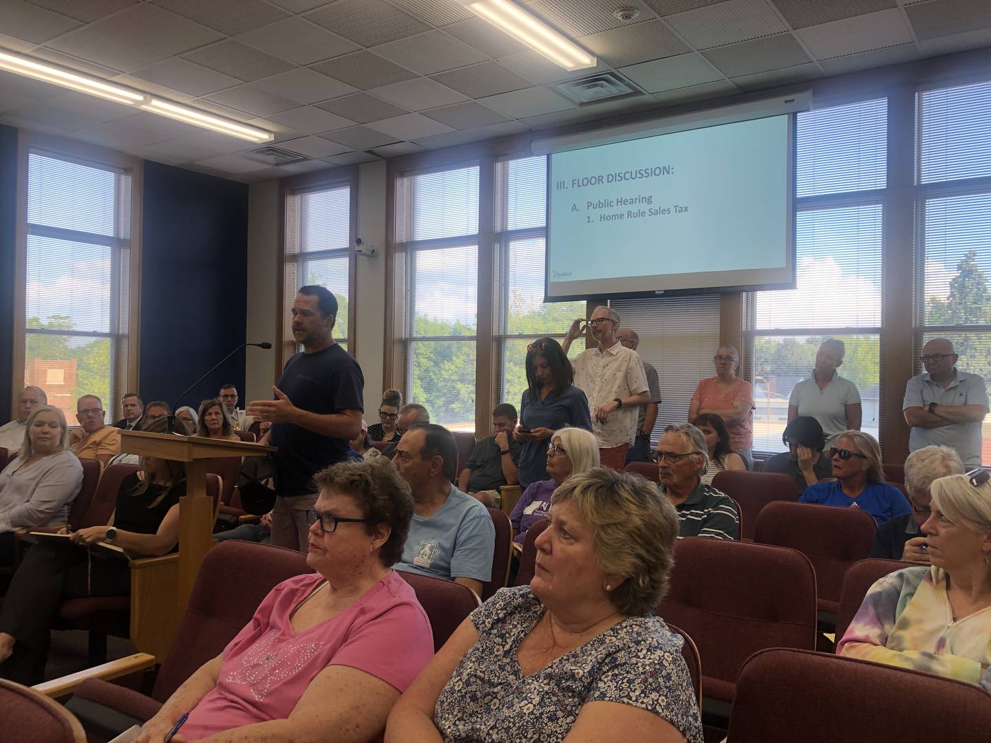 Woodstock residents lined up on Tuesday, July 15, 2025, to speak on the city's proposed .25% home rule sales tax that was approved unanimously later in the meeting.
