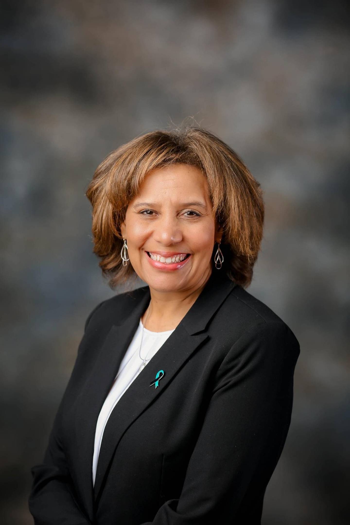 Carrie Ward, CEO of the Illinois Coalition Against Sexual Assault, will be the guest speaker at Safe Passage's annual Take Back the Night vigil on April 27, 2026, in DeKalb.