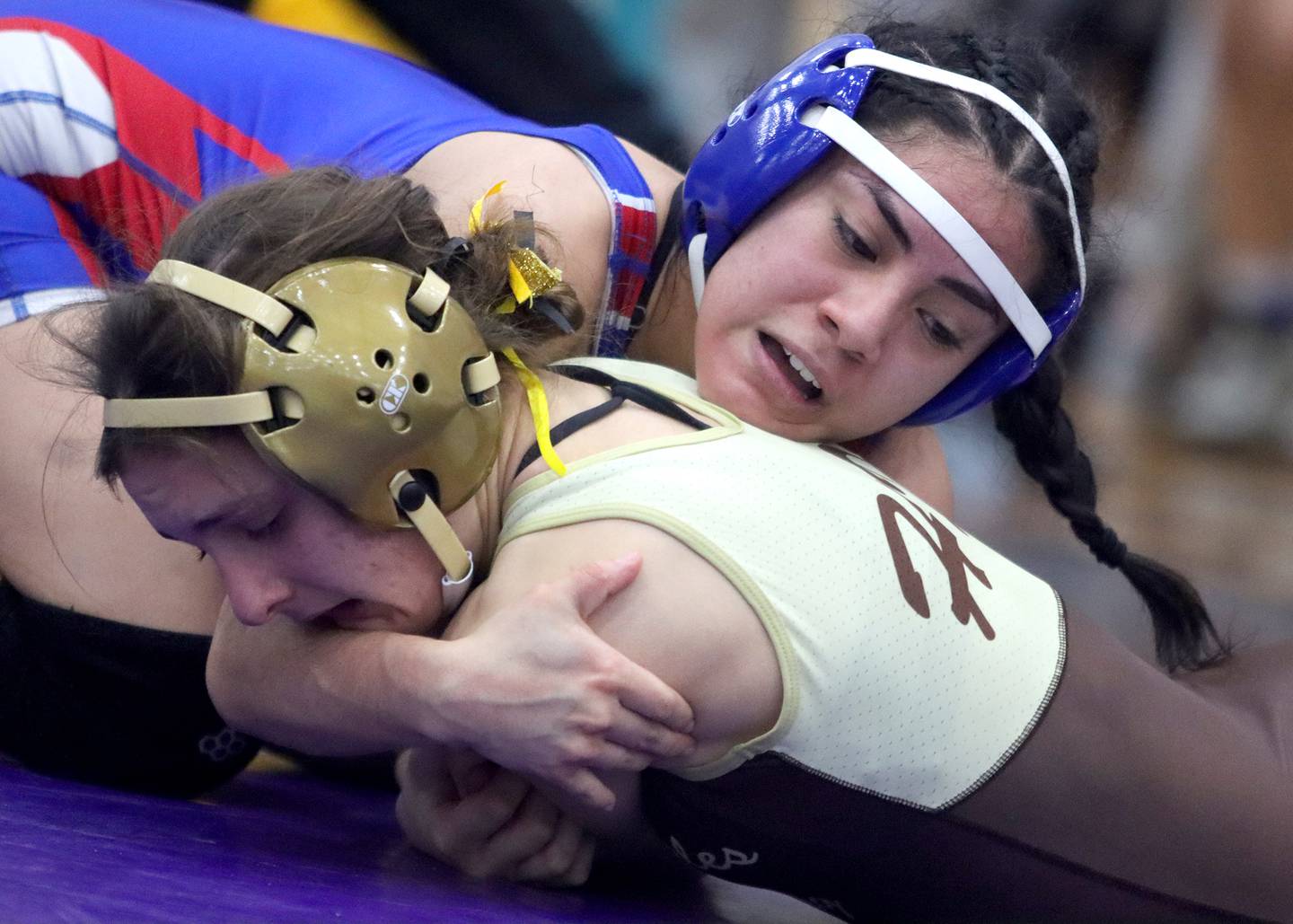 Dundee-Crown’s Diamond Rodriguez, top, battles Jacobs’ Julia Felton at 105 pounds in IHSA Regional wrestling semifinal action on Saturday, Feb. 1, 2025, at  Hampshire High School  in Hampshire.