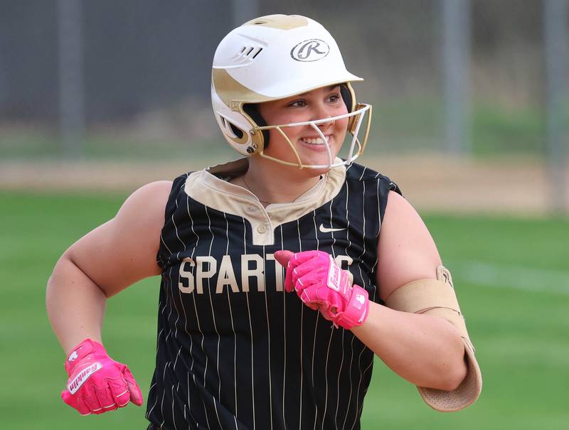 Sycamore's Kairi Lantz is all smiles as she rounds the bases after homering Friday, April 17, 2026, during thier game against Ottawa at Sycamore High School.