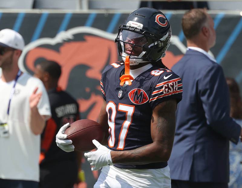 Chicago Bears wide receiver Luther Burden III carries the ball as they get loose Sunday, Aug. 10, 2025, before their preseason game against the Miami Dolphins at Soldier Field in Chicago.