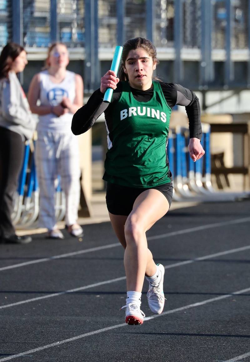 St. Bede's Lily Bosnich runs a relay in Thursday's Howard-Monier Girls Invitational at Princeton.