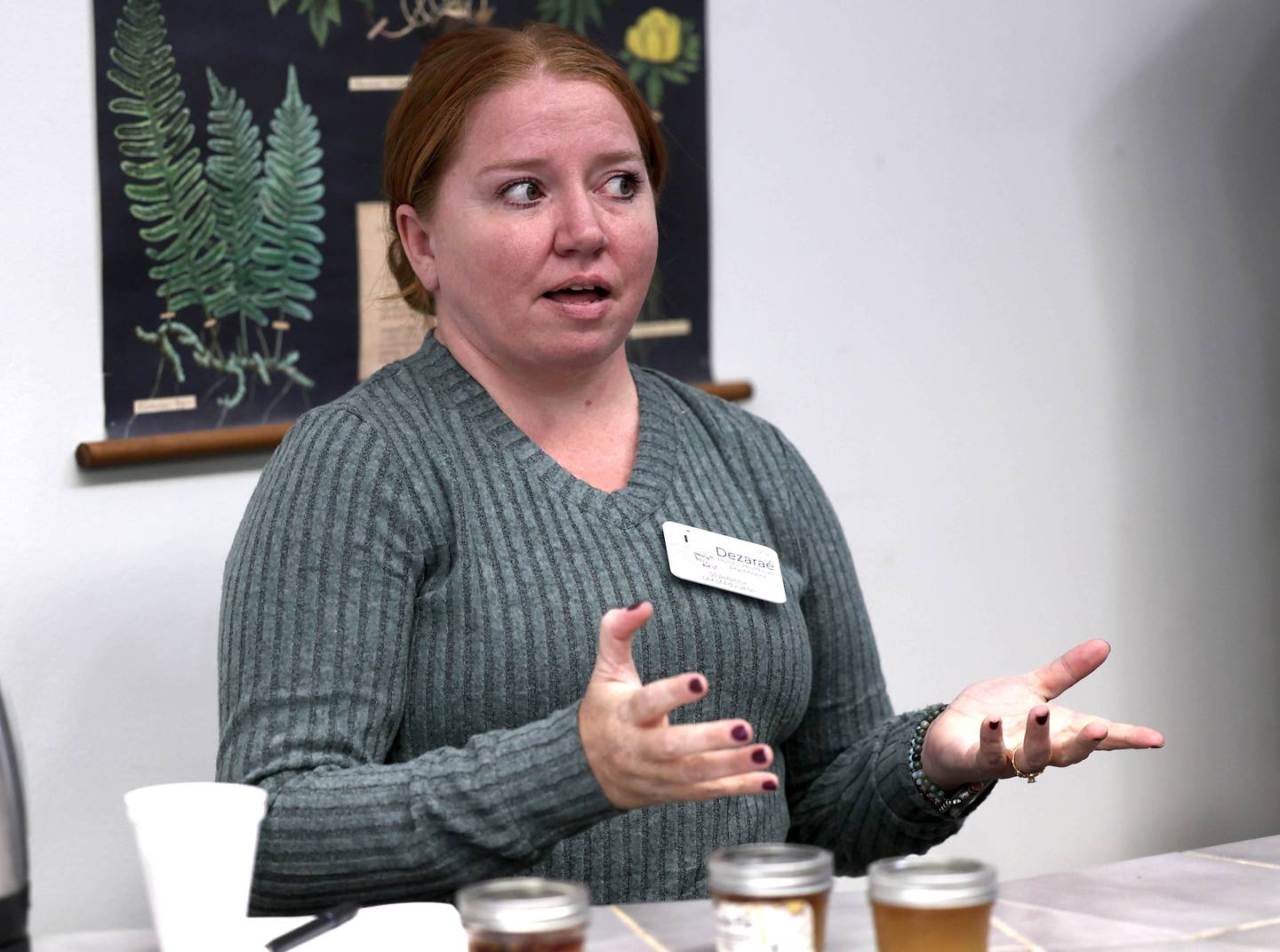 Dezaraé Haley, a U.S. Army veteran and owner of The Herbal Oracle in DeKalb, talks Thursday, Oct. 10, 2024, at her shop in downtown DeKalb, about her experiences in the service and how her natural holistic living lifestyle has made her family happier and healthier.