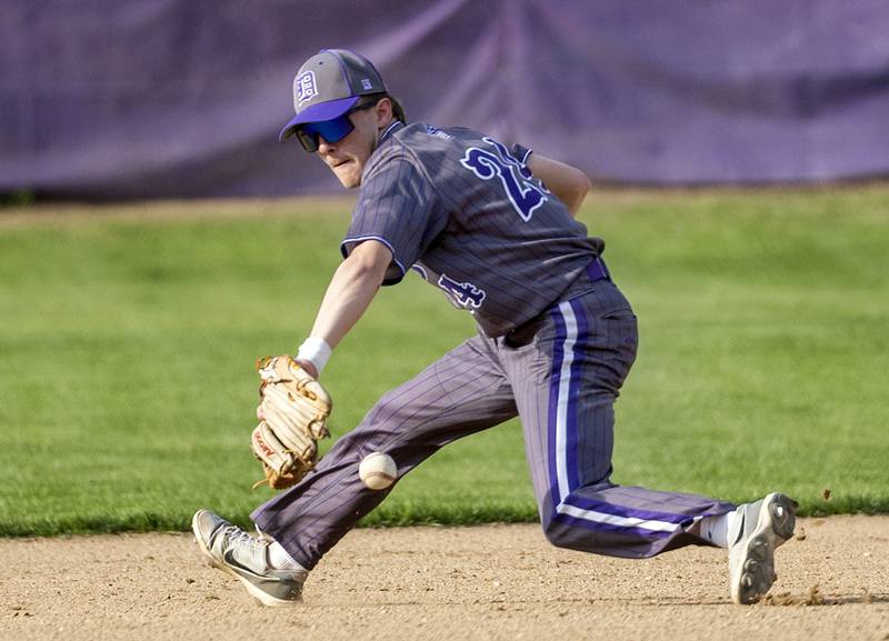 Dixon’s Brady Feit goes deep in the hole at short to snag a grounder against Oregon Thursday, April 24, 2025.