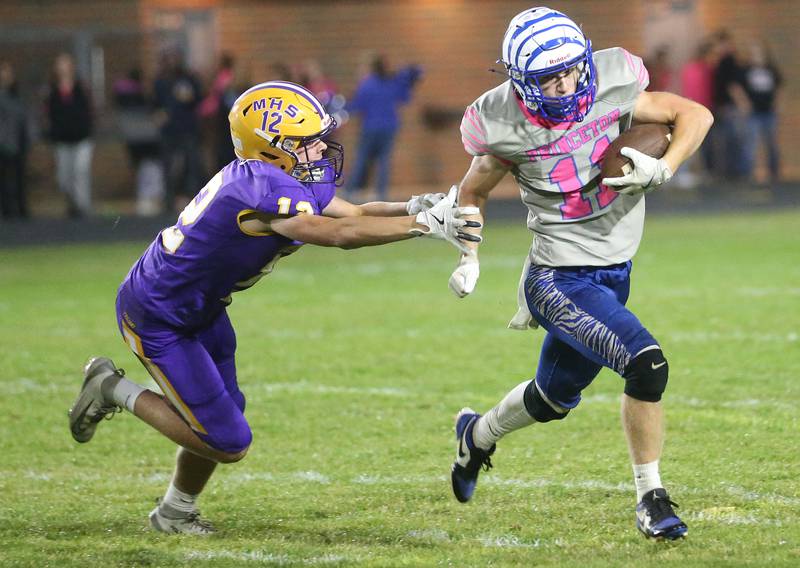 Princeton's Braden Shaw avoids a tackle from Mendota's Ross Sondgeroth on Friday, Oct. 10, 2025 at Bryant Field in Princeton.