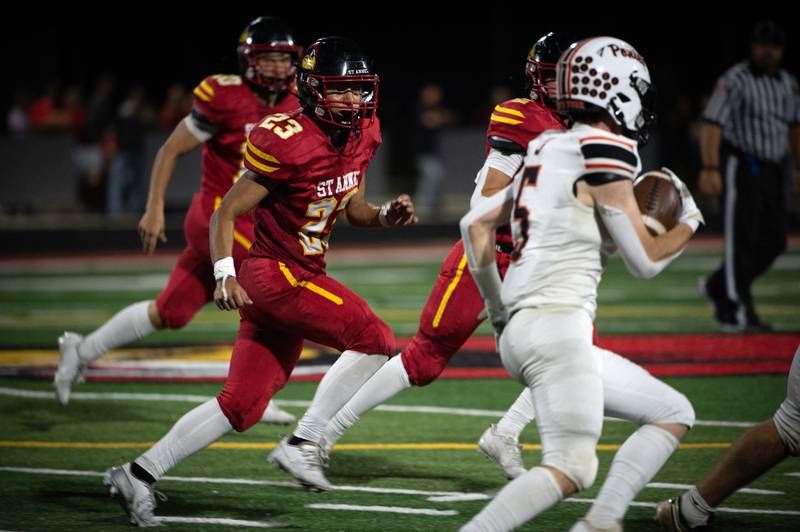 St. Anne's Gavin Threm, left, looks to make the tackle as South Fork's Brody Lush, right, carries the ball on a play in a game on Friday, September 26, 2025.