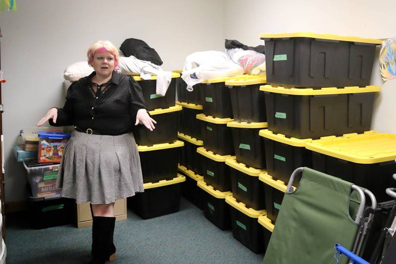 Ash Rootes, director of the overnight warming center at the Unitarian Universalist Fellowship of DeKalb, talks Thursday, Jan. 23, 2025, at the church, about the storage area where essentials for the facility are kept. The warming center, which is open nightly during the winter months, offers free hot meals to all and a warm, safe place for community members.