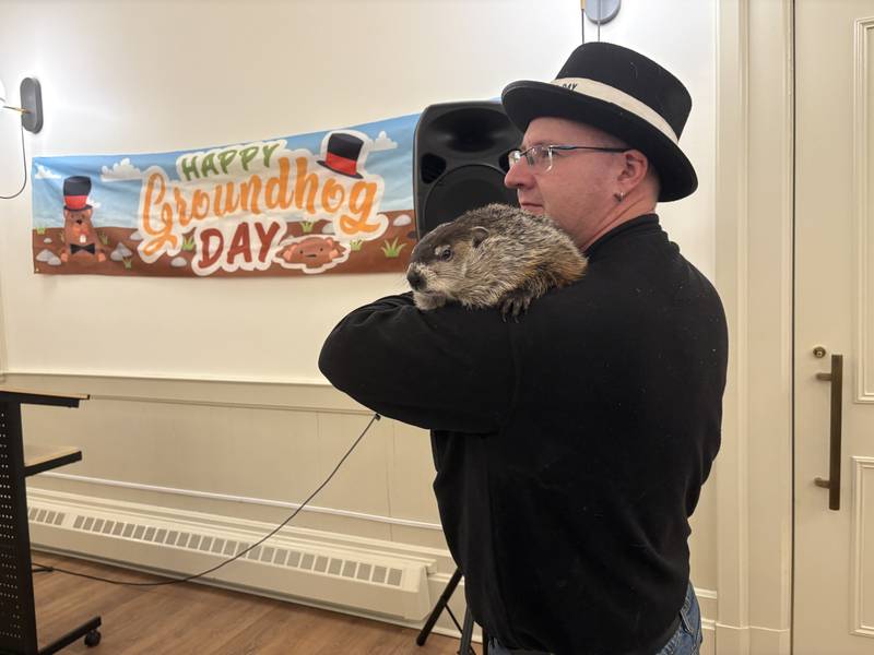 Groundhog handler Mark Szafran holds the groundhog at the Woodstock Old Courthouse Feb. 1. 2026.