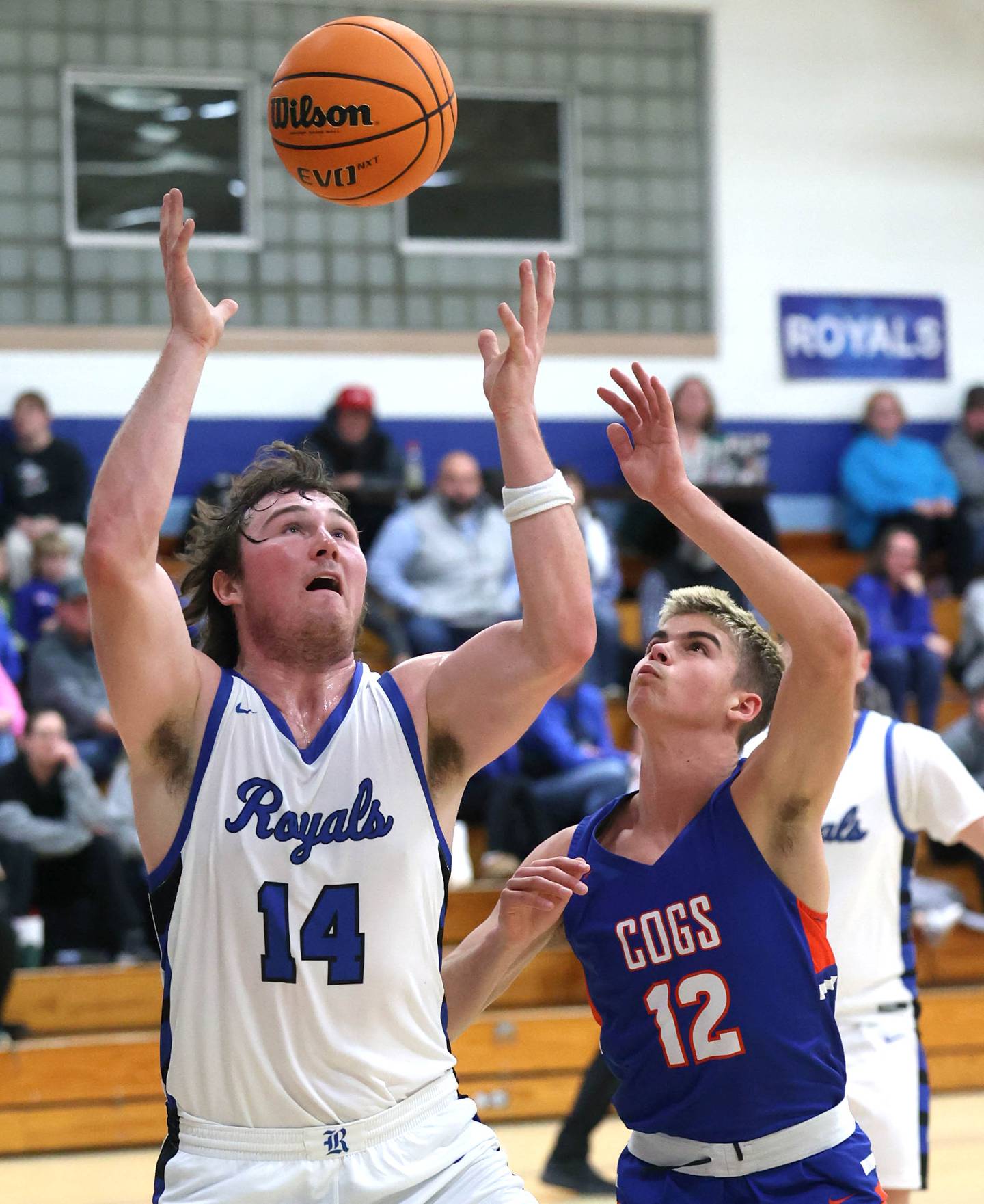 Hinckley-Big Rock's Martin Ledbetter (left) and Genoa-Kingston's John Swineheart go after a rebound during their game Tuesday, Jan. 7, 2025, at Hinckley-Big Rock High School.