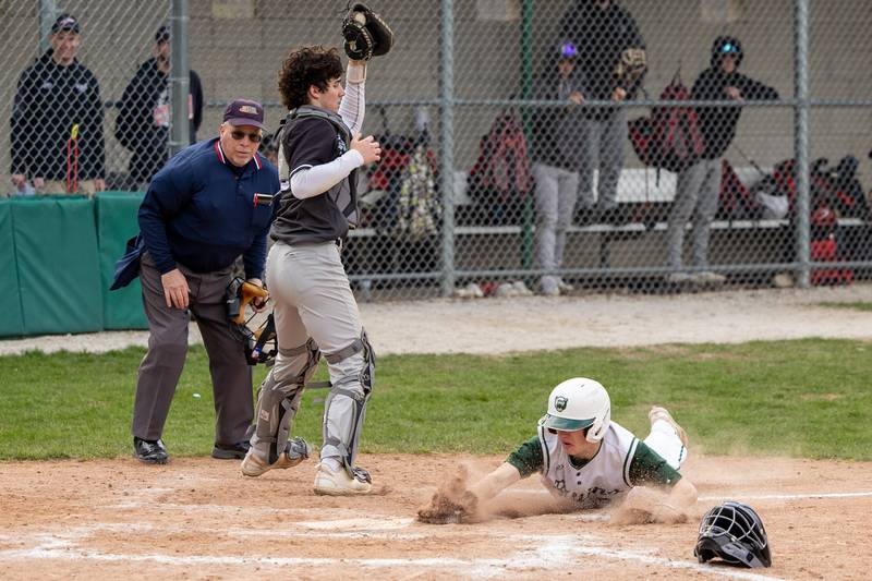 Carson Riva (3) of St. Bede slides into home plate on Thursday, April 10, 2025 at St. Bede High School in Peru.