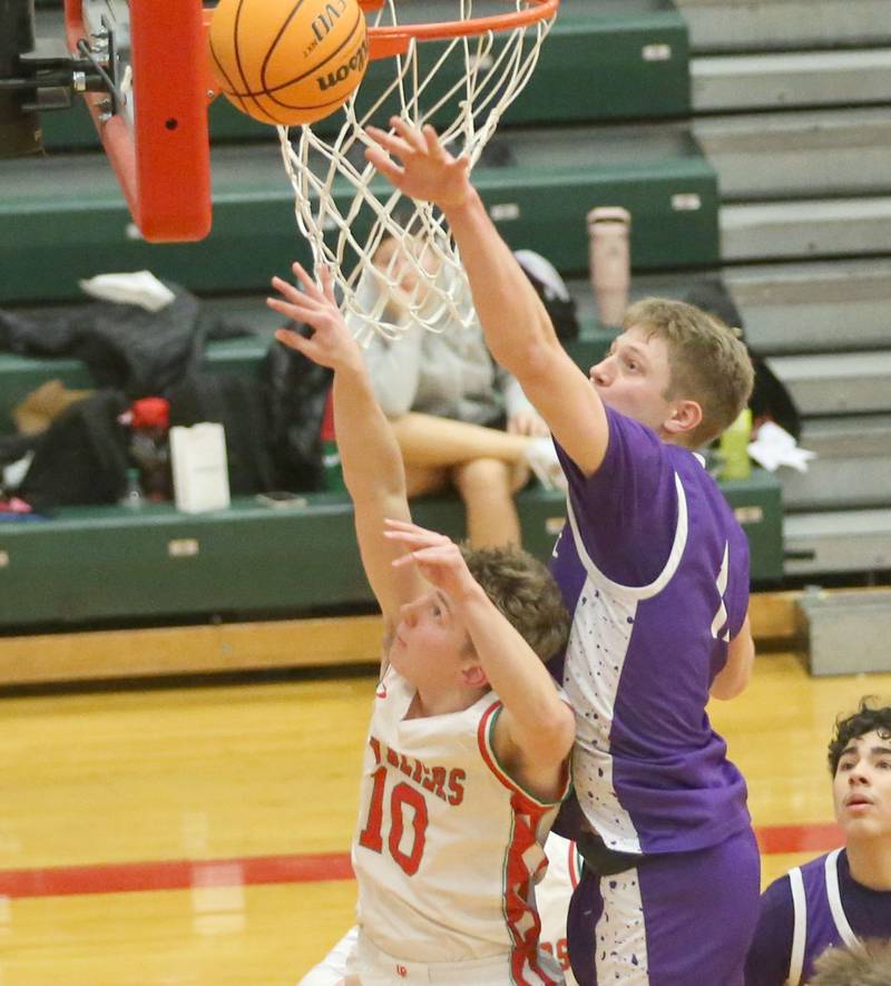 L-P's Kyle Spelich and Rochelle's Brody Bruns look to grab a rebound off the backboard on Friday, Feb. 13, 2026 in Sellett Gymnasium at L-P High School.