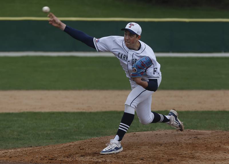 Cary-Grove's Ethan Dorchies throws a pitch during a Fox Valley Conference baseball game against Jacobs on Wednesday, April 17, 2024, at Cary-Grove High School. The game was stopped for darkness after the 9th inning with the score tied 6-6.