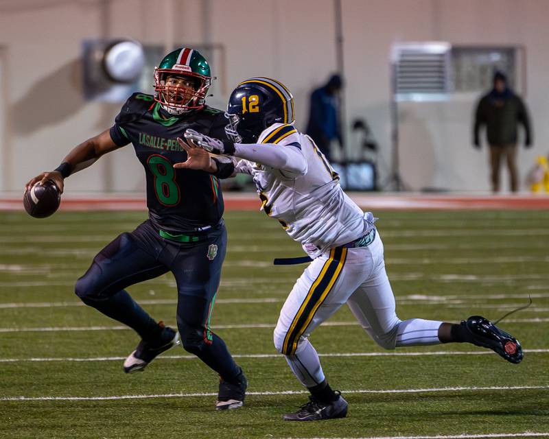 Marion Persich (8) of L-P runs ball as Taylin Abram (12) of O' Fallon chases on Friday, October 24, 2025 at Howard Fellows Stadium in LaSalle.