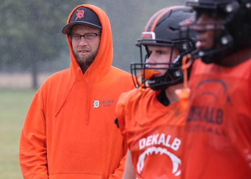 Matt Quinto, U.S. Navy veteran and DeKalb High School football coach, watches his players during practice Tuesday, Sept. 24, 2024, at DeKalb High School.