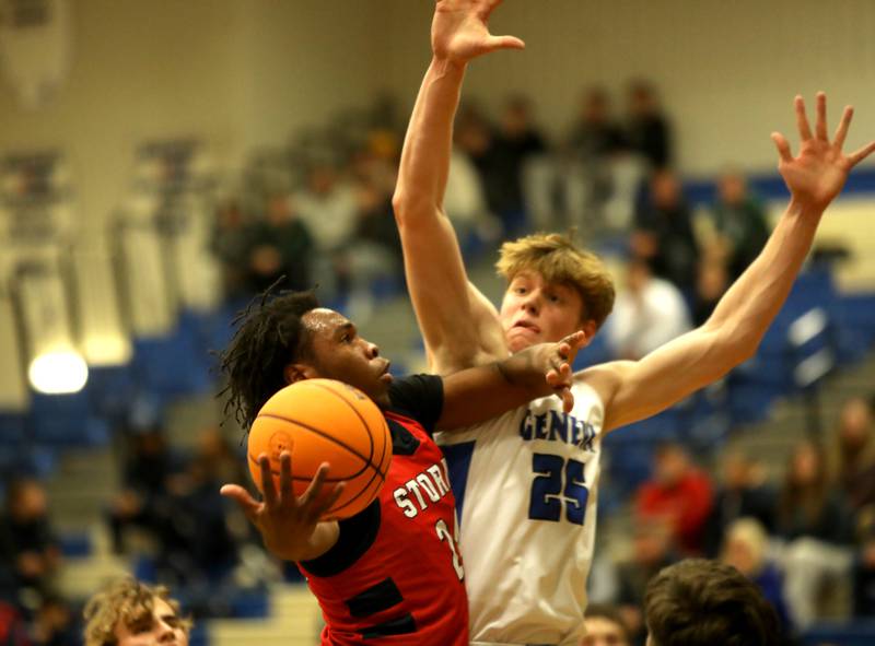South Elgin’s Ishmael George tries to get past Geneva’s Hudson Kirby during a game on Monday, Nov. 25, 2024 in Geneva.