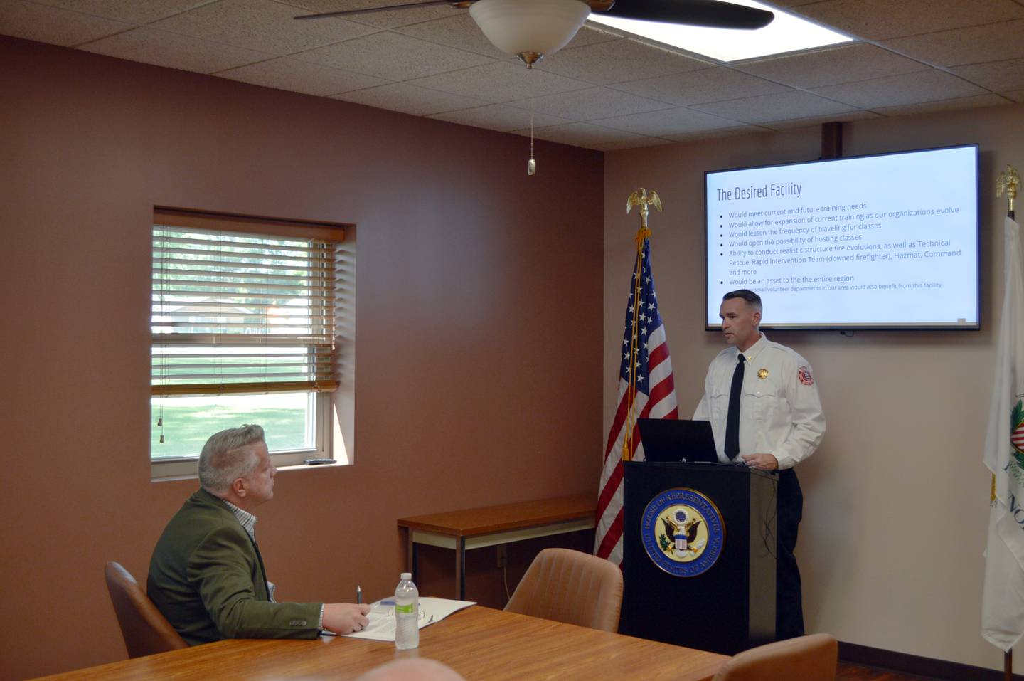 U.S. Rep. Eric Sorensen, D-Rockford (left) listens on Friday, Aug. 9, 2024, in the Rock Falls Fire Department as Rock Falls Deputy Fire Chief Kyle Sommers talks about the training center the two fire departments plan to build. Sorensen is requesting $1.5 million in federal funding to go toward the project.