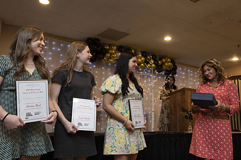 Nominees for the Young Women of Tomorrow award at the YWCA Women of Achievement Luncheon Ainsley Reed (left), Tayla Wendt and Blerina Mimini are recognized Thursday, April 13, 2023. Mimini was given the award.