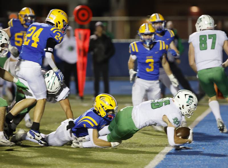 York's Henry Duda (26) crosses the goal line for a touchdown during the varsity football first-round 8A playoff game between York and Lyons Township on Friday, Oct. 31, 2025 in Western Springs, IL.