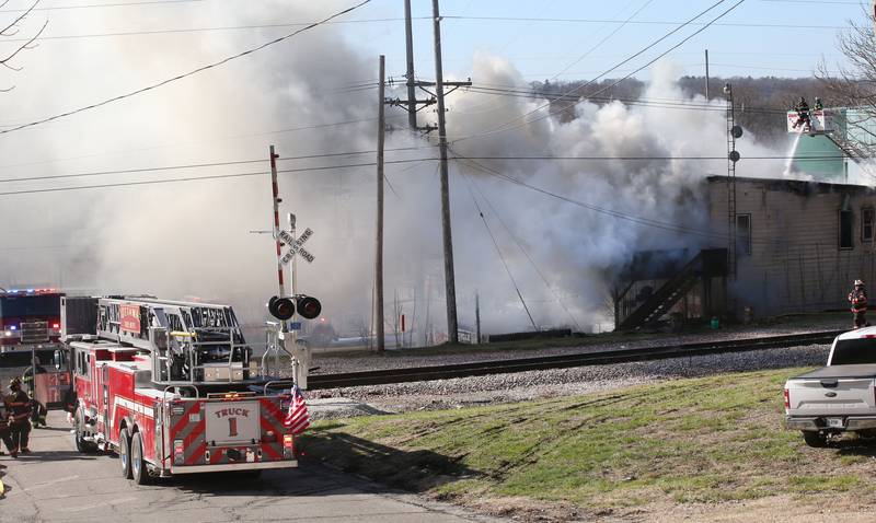 Ottawa firefighters arrive to the scene of fire at the former Platform 31 tavern on Monday, March 24, 2025 on Water Street in Peru. The fire was upgraded to a three-alarm summing ire departments from La Salle, Utica, Mendota, Tonica, Ottawa, Ladd, Spring Valley, Lostant, Cedar Point, Troy Grove and Peru responded to the fire.