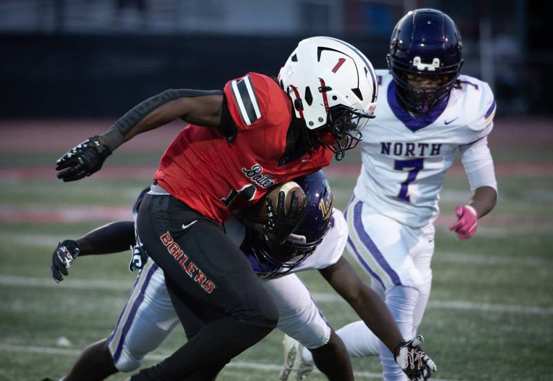 Bradley-Bourbonnais' Kyren Edmon carries the ball on a play in a game against T.F. North on Friday, August 29, 2025.