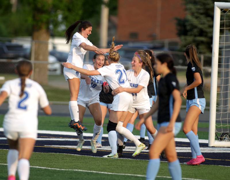 Geneva players celebrate a goal by teammate Lilly Coats during a Class 3A West Chicago Sectional semifinal against St. Charles North on Tuesday, May 23, 2023.