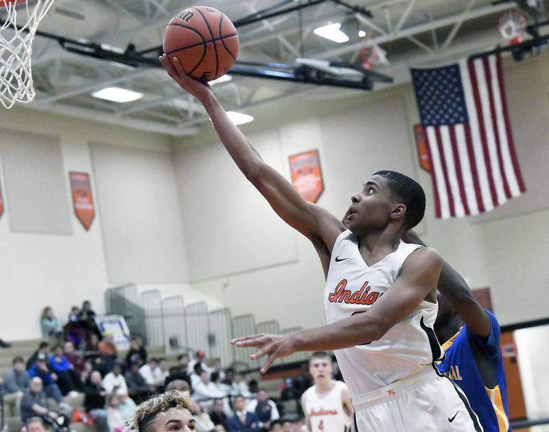 Minooka's Brandon Hill drives to the basket during Friday night's game against Joliet Central, which the Indians lost, 51-36. However, they rebounded Saturday night and beat Joliet Catholic, 50-36.
