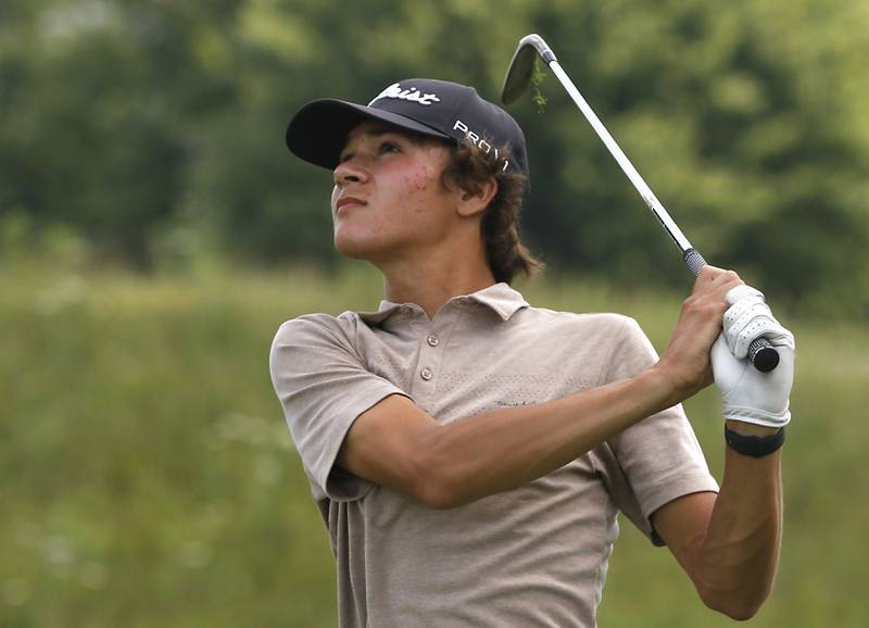 Jack Wilcox watches his tee shot on the fourth hole during the final round of McHenry County Junior Amateur Golf Tournament  on Tuesday, July 18, 2025, at Foxford Hills Golf Club in Cary.