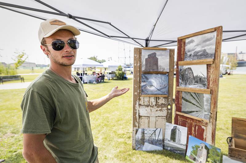 Christian S. Landorf shows off his display of photography Saturday, Aug. 24, 2024, at Rock Falls Tourism’s Art in the Park sculpture walk. Landorf’s work mostly focuses on documenting the rural landscape.
