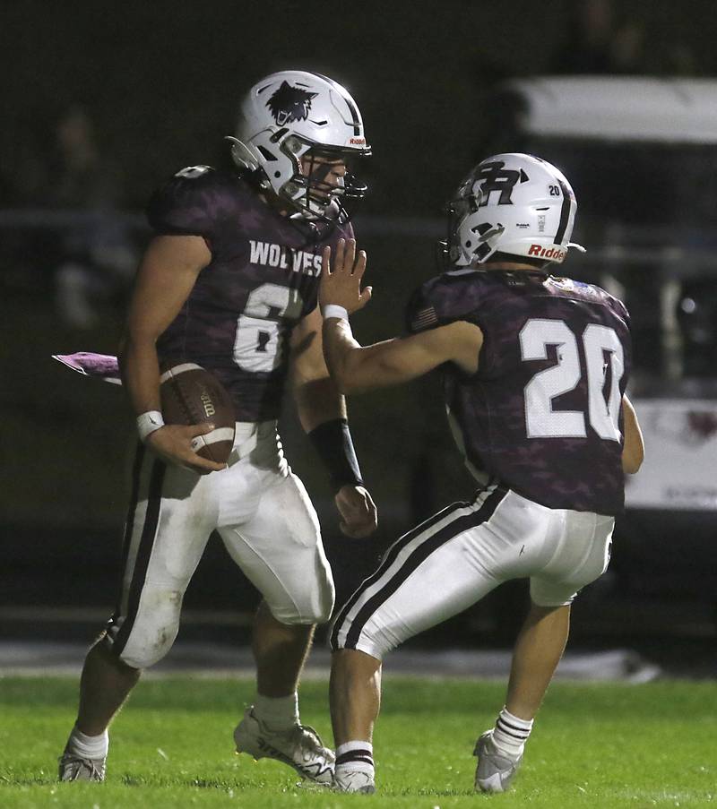 Prairie Ridge's Luke Vanderwiel celebrates hit touchdown with \teammate Prairie Ridge's Jesse Kautz during a Fox Valley Conference football game against Cary-Grove on Friday, Sept. 27, 2024, at Prairie Ridge High School.