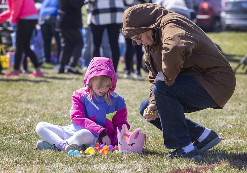 Ruby Broderick, 7, and grandpa Mike Broderick count up the eggs Saturday, March 23, 2024 in Sterling.
