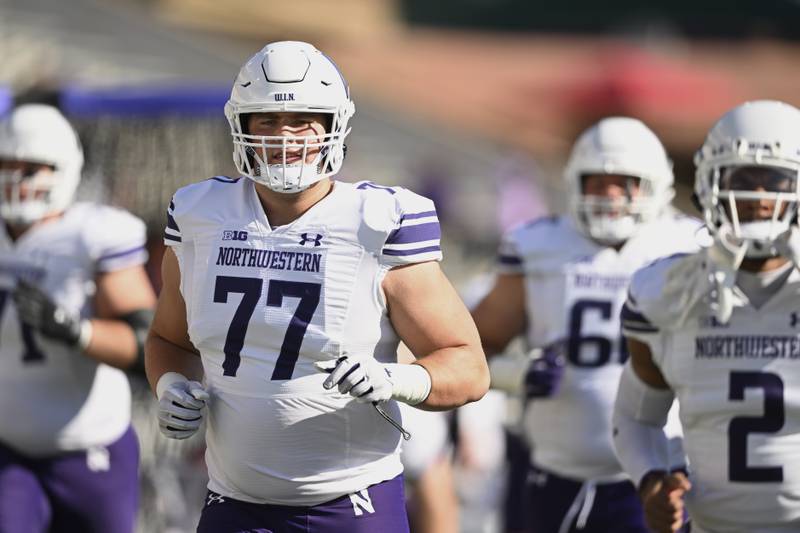 Northwestern offensive lineman Peter Skoronski warms up before a game against Maryland, Saturday, Oct. 22, 2022, in College Park, Md.