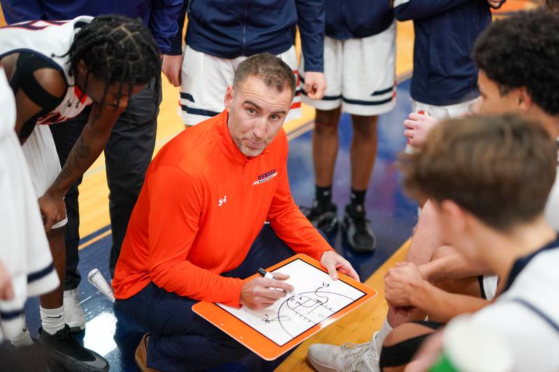Oswego’s head coach Nick Oraham draws up a play against Rockford Guilford during a hoops for healing basketball tournament game at Oswego on Monday, Nov. 25, 2024.