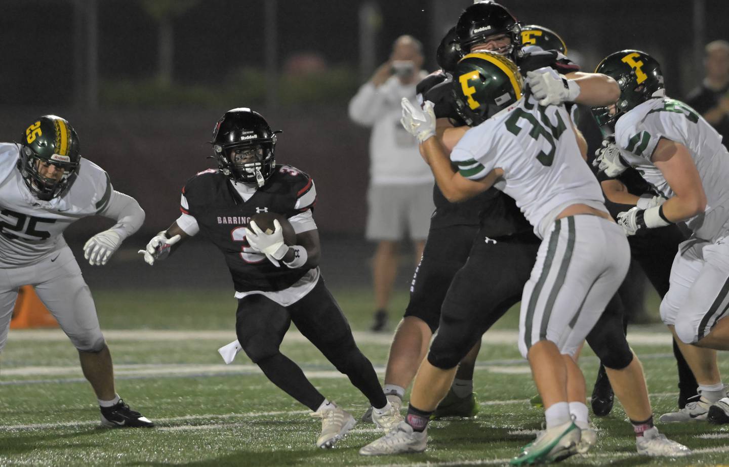 Barrington’s Lamar Osterhues makes a cut against Fremd in a football game in Barrington on Friday, Oct. 10, 2025.