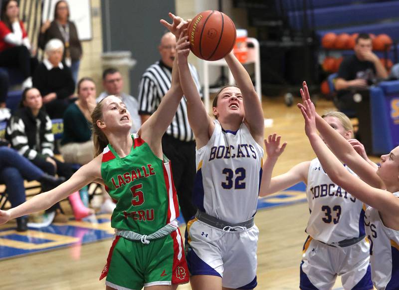 LaSalle-Peru's Addison Urbanski and Somonauk's Haley McCoy go after a rebound during their game Thursday, Nov. 16, 2023, in the Tim Humes Breakout girls basketball tournament at Somonauk High School.