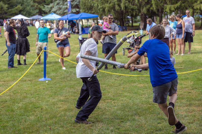 Damien Montoya (left), 15, of Dixon and Dawson Rawls, 13, of Kings face off in combat Saturday, Sept. 21, 2024, at Lowell Park’s Fall and Fantasy Fest. Volunteers were able to put on display their ancient fighting skills with a number of soft replica weapons.