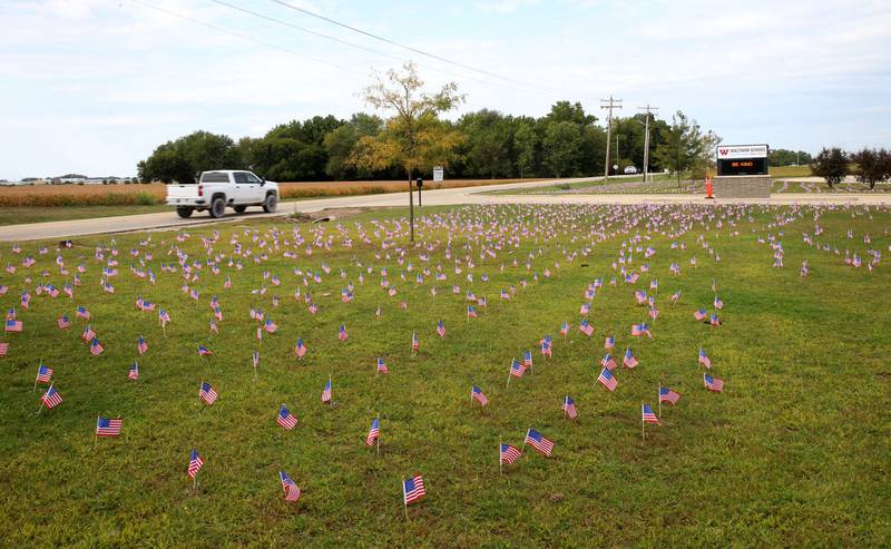 Waltham School placed 2,977 flags outside the school lawn to remember the lives lost in the 9/11 attacks on Thursday, Sept. 11, 2025 in Utica.