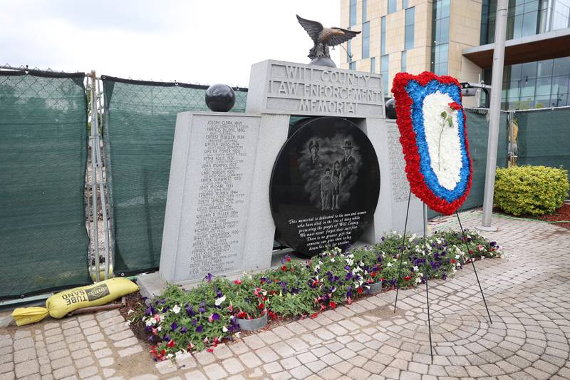 The memorial wreath sits in front of the Will County Law Enforcement Memorial at the memorial ceremony on Thursday, May 9, 2024 in downtown Joliet.