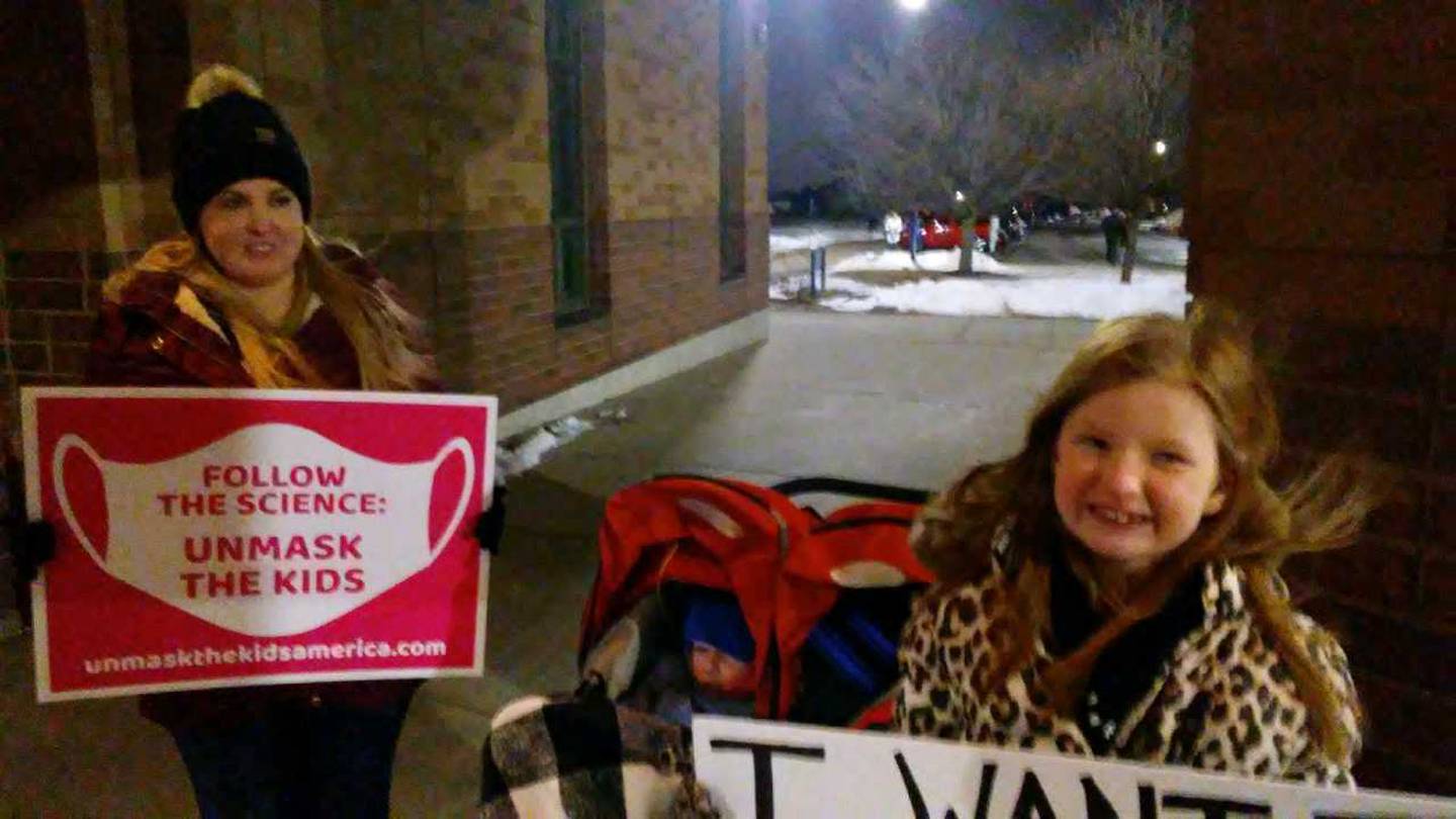Sara Cole of Oswego and her daughter, Gracy, a third grade student at Hunt Club Elementary School in Oswego, prior to the Oswego School Board meeting Feb. 10, 2022 at Oswego East High School. (Mark Foster - mfoster@shawmedia.com)