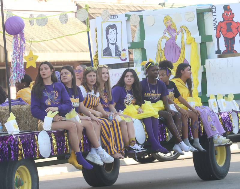 Members of the Mendota High School volleyball team ride down Indiana Avenue during the homecoming parade on Friday, Oct. 3, 2025