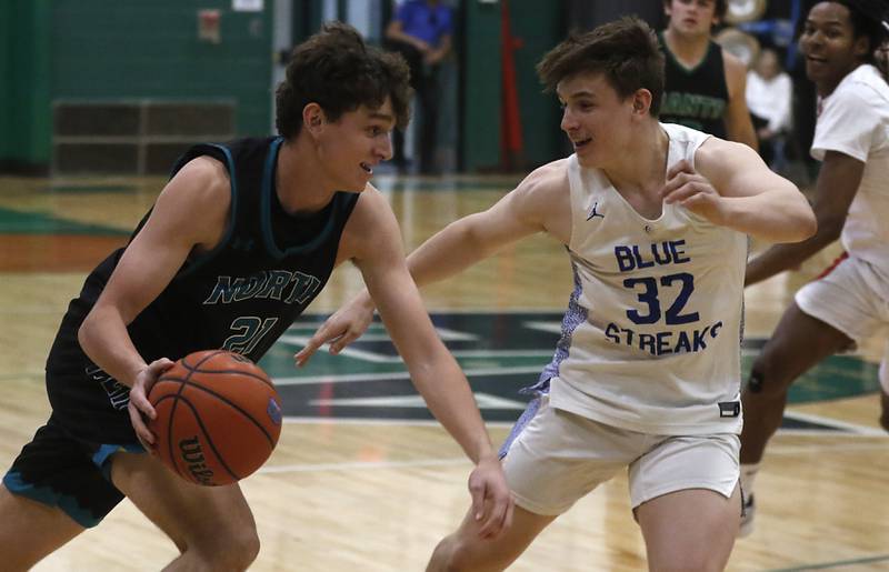 Woodstock North's Cade Blaksley tries to drive on Woodstock's Keaton Perkins during the boy’s game of McHenry County Area All-Star Basketball Extravaganza on Sunday, April 14, 2024, at Alden-Hebron’s Tigard Gymnasium in Hebron.
