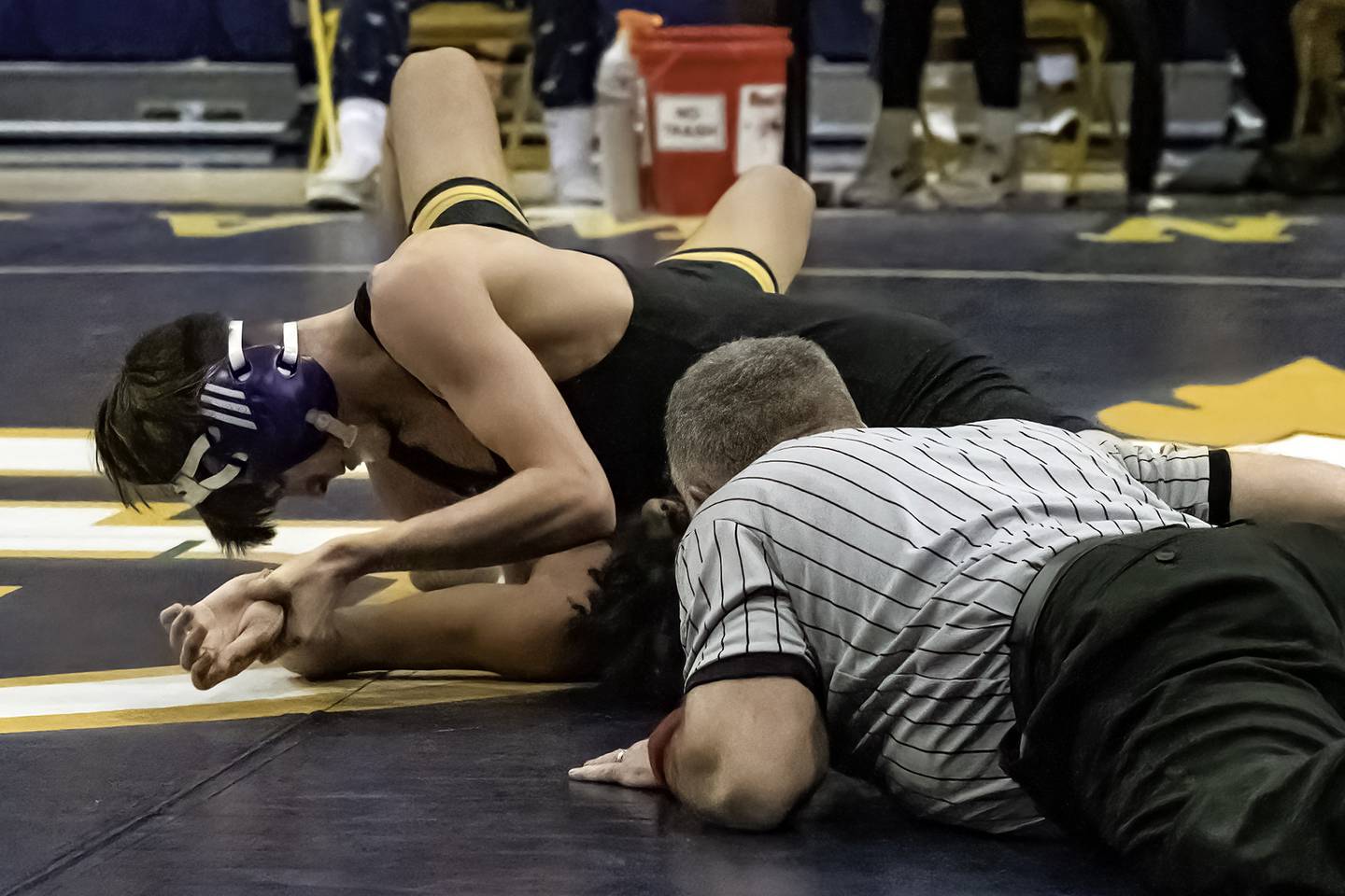 Dixon's Ayden Rowley (top) pins Galesburg's Christian Delacruz during their 113-pound title bout at the 44th annual Carson DeJarnatt Tournament on Saturday, Dec. 3, 2022 at Musgrove Fieldhouse in Sterling.