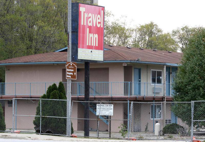 The vacant Travel Inn, formerly a 120-room hotel at 1116 W. Lincoln Highway in DeKalb, sits behind fencing Tuesday.