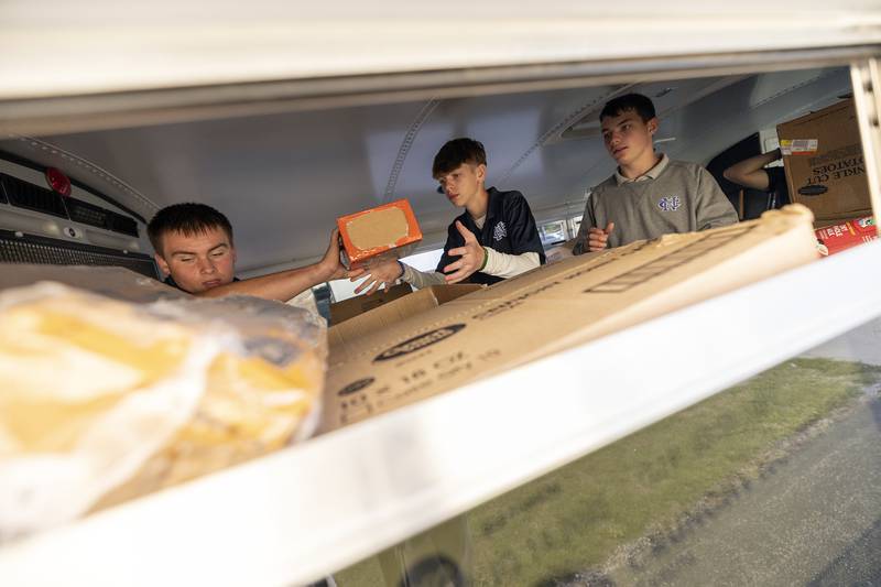 Newman students sort through items that will go to one of seven local pantries Thursday, Oct. 3, 2024.