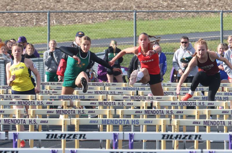 (From left) Sterling's Abby Ryan, Coal City's Madelyn Castle, Ottawa's Isabella Markey, and Morris's Leah Martin compete in the 100 meter hurdles during the Class 2A Sectional track meet on Wednesday, May 13, 2026 in the Jeff Prusator Athletic Complex at Mendota High School.