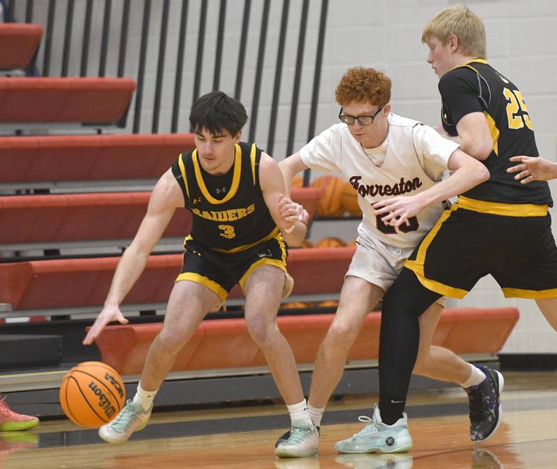 AFC's Chase Near handles the ball as Forreston's Noah Genandt fights around a screen by Kyler Willstead on Saturday, Jan. 17, 2026 at Forreston High School.