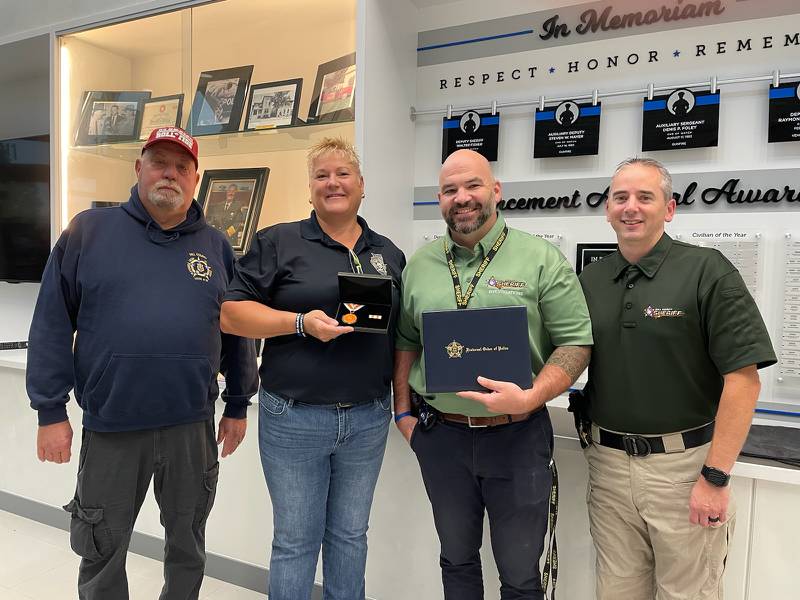 Will County Sheriff’s Detective Shaun Moran (first from right) was recognized for stopping attempted robberies while off duty. To Moran's right is Will County Sheriff's Deputy Chief Dan Jungles. From the left is Will County Sheriff’s FOP Lodge 94 Trustee Ron Adams and Lodge 94 President Bridget Graham.