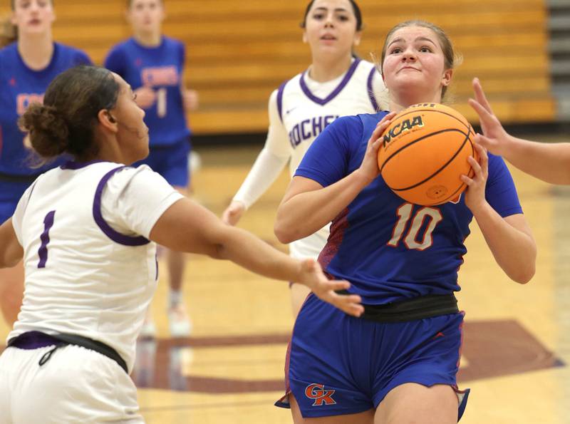 Genoa-Kingston's Arielle Rich goes to the basket against Rochelle's Carmela Bright during their game Monday, Dec. 15, 2025, at Rochelle High School.