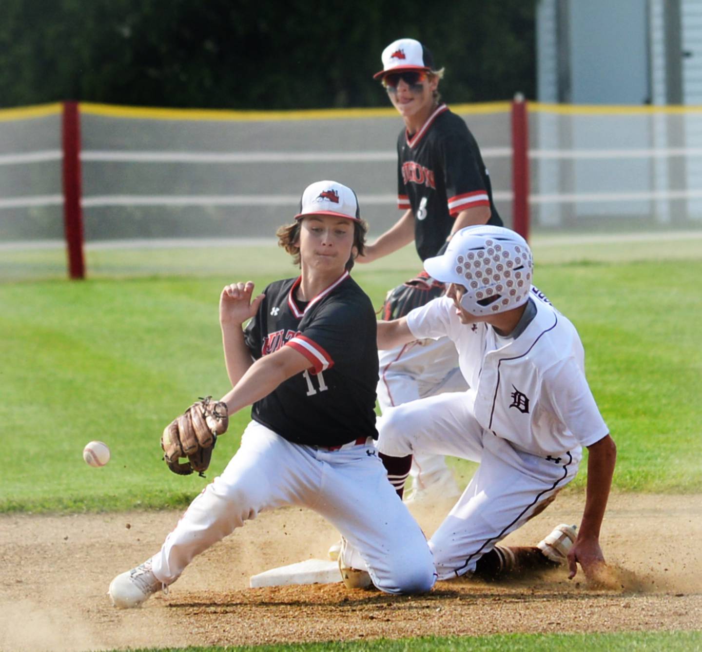 Fulton's Braedon Brennan reaches for a throw as a Dakota runner steals second base during afternoon action at the 1A Pearl City Sectional on Wednesday, May 24.